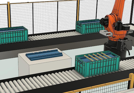 KUKA robot load station in the automation training cell, with trays on a motorised roller conveyor 